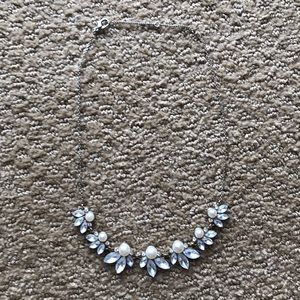 Necklace with rhinestones and pearls.